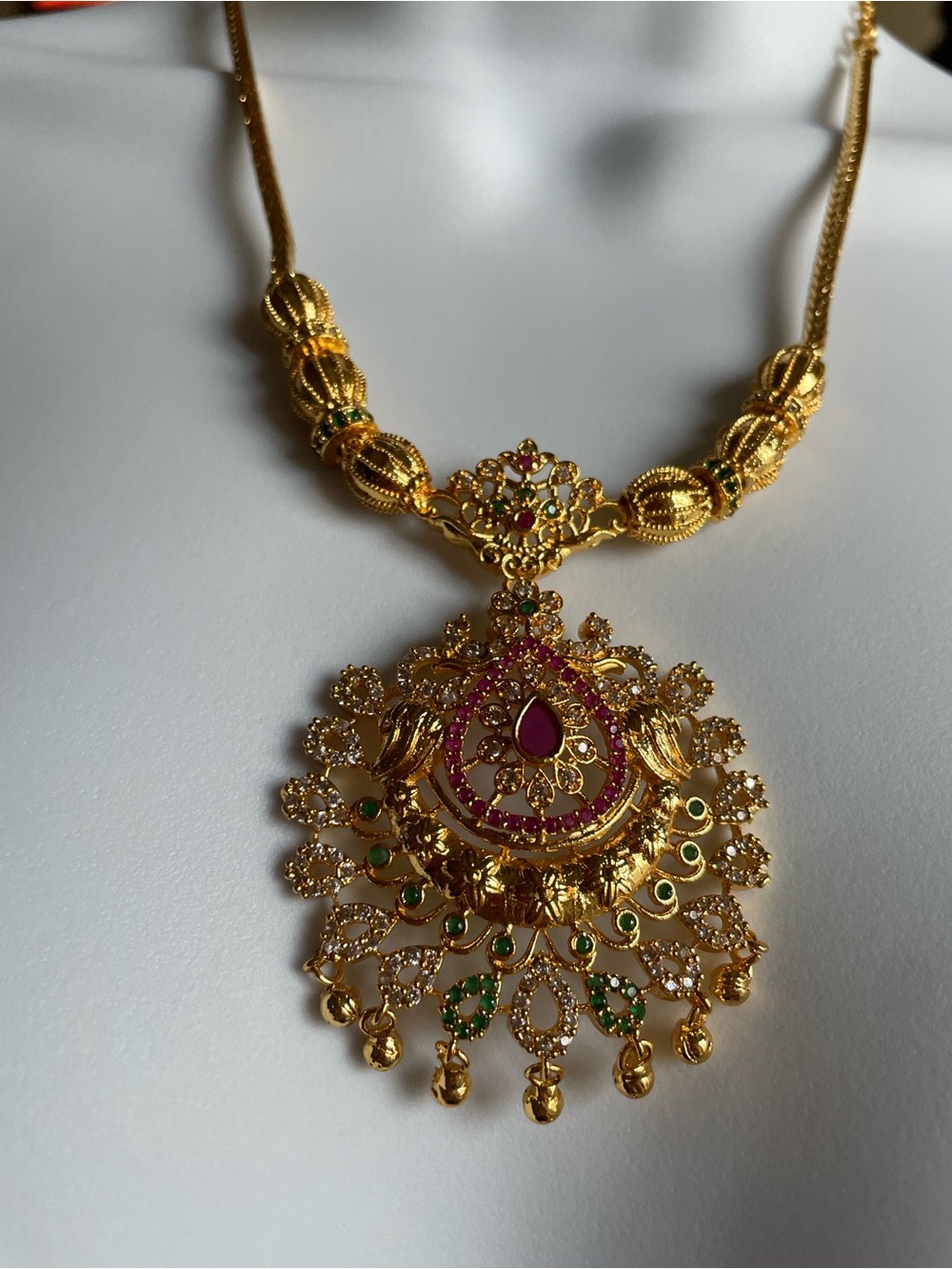 Traditional Gold-Tone Pendant Necklace with Pink and Green Accents